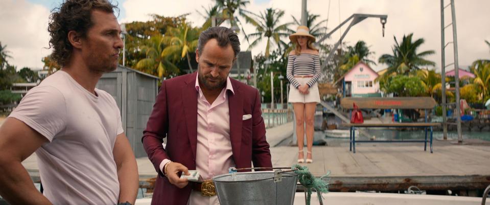 Boat captain Baker Dill (Matthew McConaughey, left) is hired by the abusive husband (Jason Clarke) of his ex-wife (Anne Hathaway) for a fishing expedition in the neo-noir mystery "Serenity."