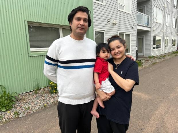 Akash Kumar Mishra with his wife Shreya Karki and their young son. 