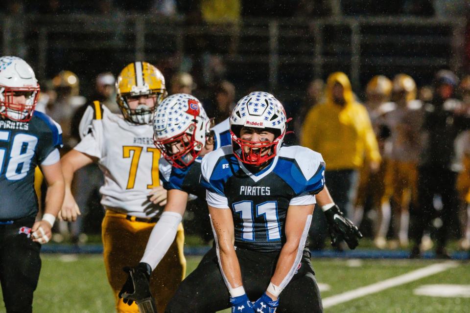 Garaway's Jayce Wallick celebrates a broken up pass during the Division VI, Region 23 final against West Jefferson, Friday, Nov. 17 at John D. Sulsberger Memorial Stadium in Zanesville, Ohio.