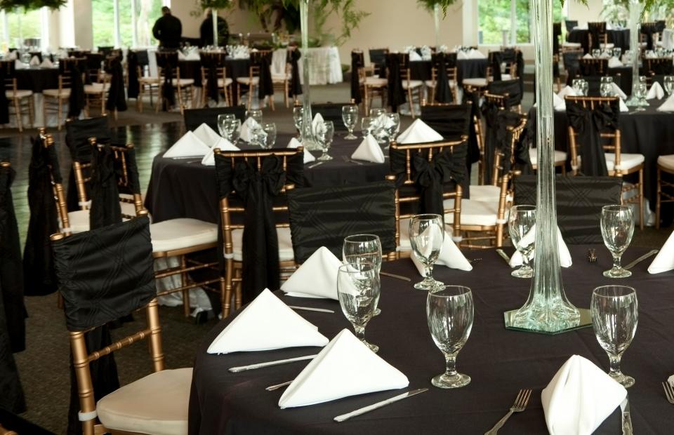 Wedding reception venue with tables prepared for guests