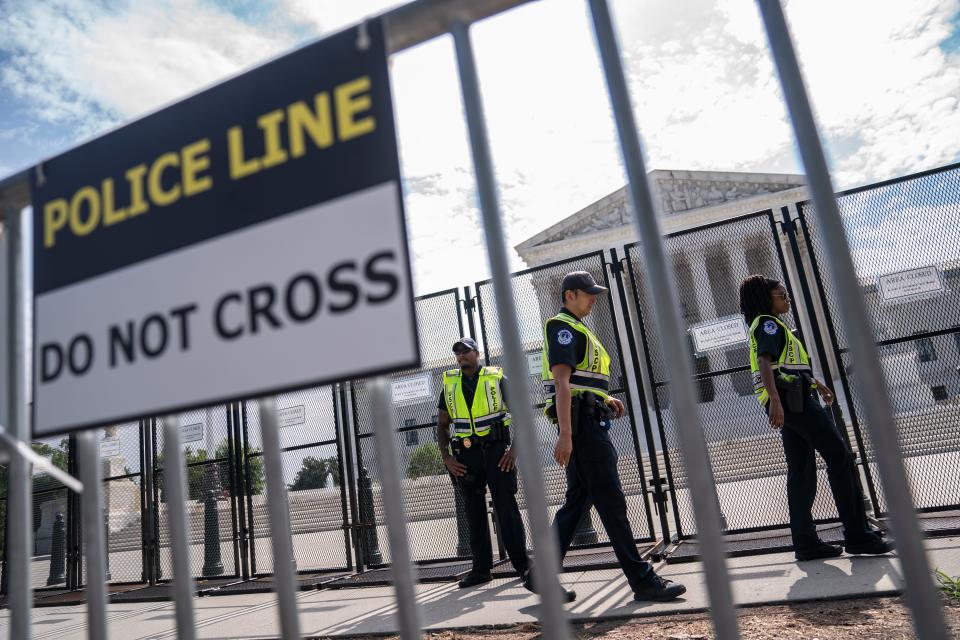 U.S. Capitol Police guard a security fence surrounding the Supreme Court on June 8, 2022, in Washington, D.C. The court is expected to announce a series of high-profile decisions this month.