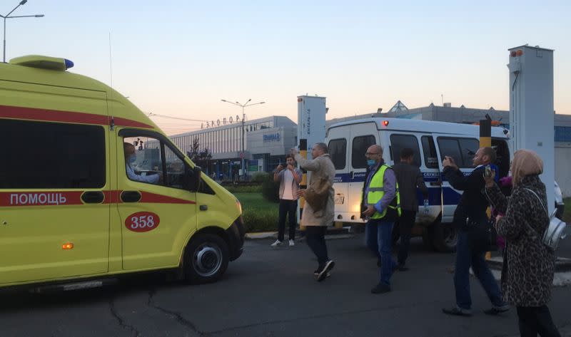 An ambulance transporting Russian opposition leader Alexei Navalny arrives at an airport in Omsk