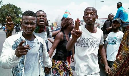 Congolese opposition activists gesture during a march to press President Joseph Kabila to step down in the Democratic Republic of Congo's capital Kinshasa, September 19, 2016. REUTERS/Stringer