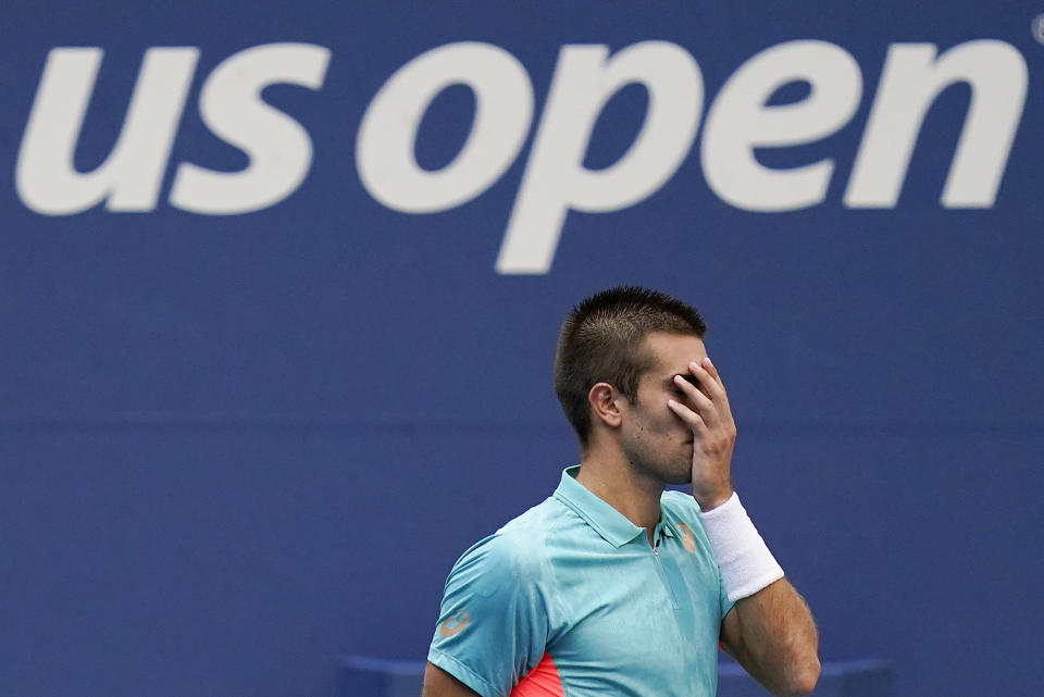 Borna Coric, of Croatia, reacts during match against Alexander Zverev, of Germany, during the quarterfinals of the US Open tennis championships, Tuesday, Sept. 8, 2020, in New York. (AP Photo/Seth Wenig)