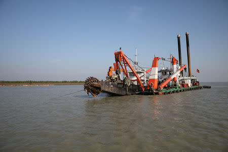 A dredging machine is seen near the Vashan Char, previously known as Thengar Char island, in the Bay of Bengal, Bangladesh February 14, 2018. REUTERS/Stringer