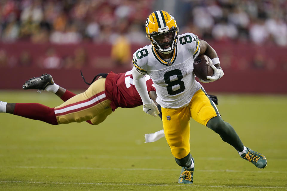 Green Bay Packers wide receiver Amari Rodgers (8) runs past San Francisco 49ers cornerback Dontae Johnson to score during the second half of an NFL preseason football game in Santa Clara, Calif., Friday, Aug. 12, 2022. (AP Photo/Godofredo A. Vásquez)