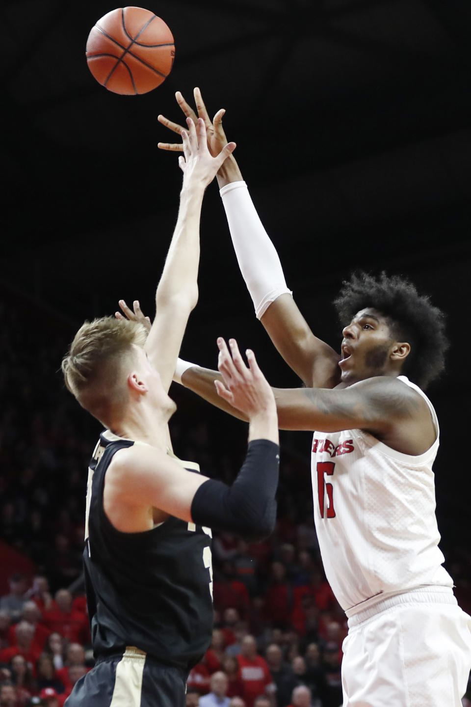 Rutgers center Myles Johnson, right, shoots over Purdue center Matt Haarms during the second half of an NCAA college basketball game Tuesday, Jan. 28, 2020, in Piscataway, N.J. (AP Photo/Kathy Willens)