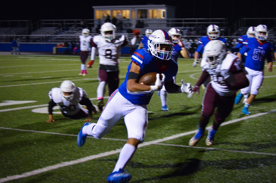 Highland running back Dane Nauman runs the football against Linden McKinley in a Division IV, Region 15 playoff game last season. The Scots moved down to Division V's Region 18 this upcoming season.