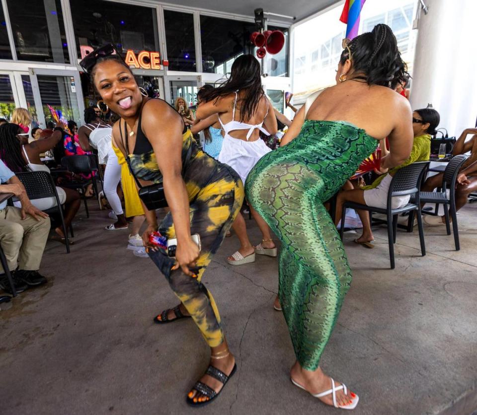 Friends Toni Boykins, 30, left, and Jaliya Quinones, 30, right, dance together as they celebrate thier friendship of 20 years at Palace Bar & Restaurant off Ocean Drive during Memorial Day weekend at Miami Beach, Florida, on Monday, May 29, 2023.