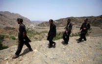 FILE PHOTO: Members of Pakistan's Frontier Corps patrol the border with Afghanistan outside Torkham, Pakistan June 16, 2016. REUTERS/Fayaz Aziz/File Photo