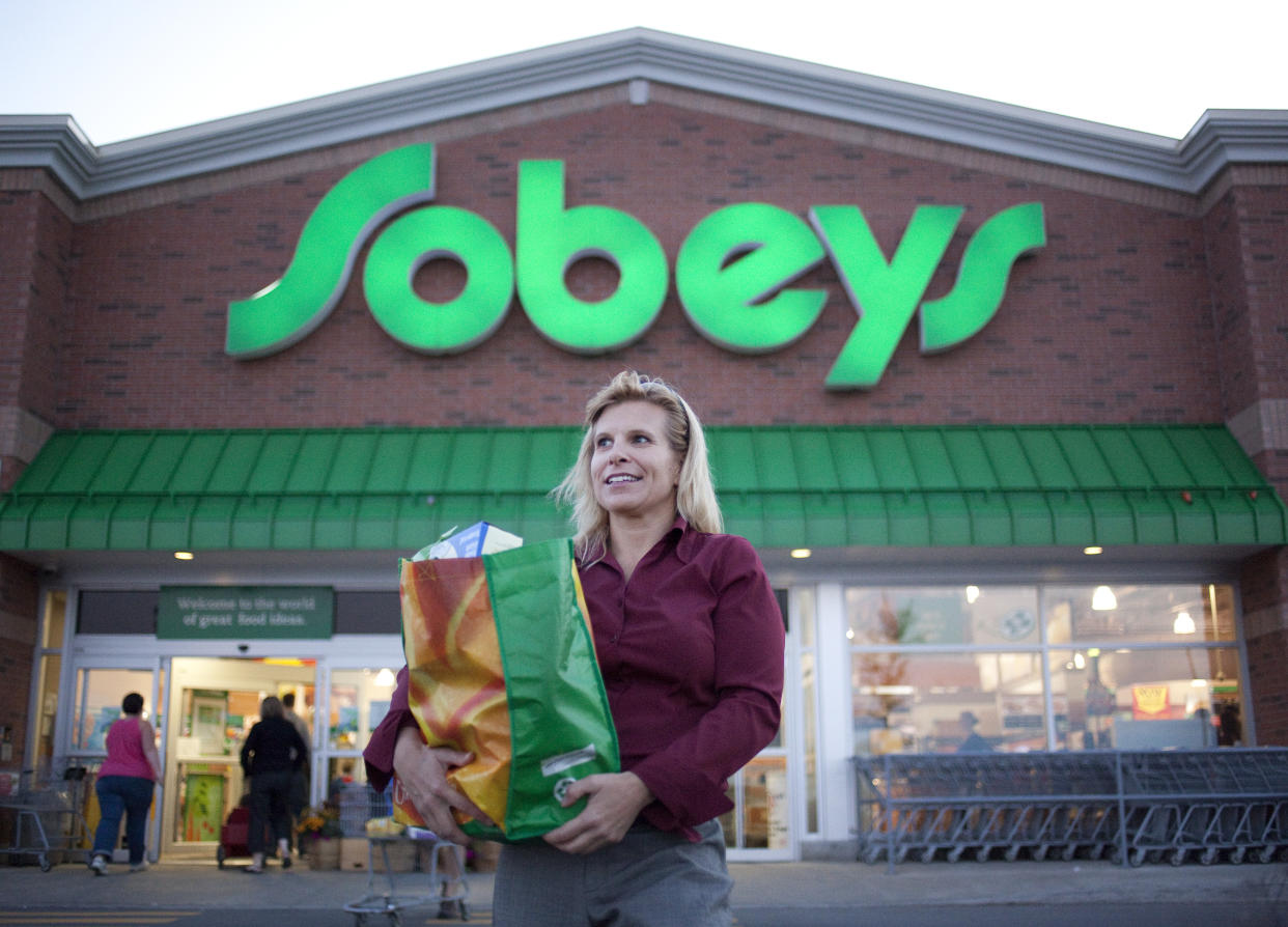 September 24, 2009 - Tracy Killins poses for a photo outside of a Sobeys in Ottawa Ontario where she collects travel rewards points and then tries to gain more value from them by exchanging them. Killins says she can collect double points by using her Sobeys card first and then paying with her Presidents Choice Mastercard for more points. (Photo by Pawel Dwulit/Toronto Star via Getty Images)