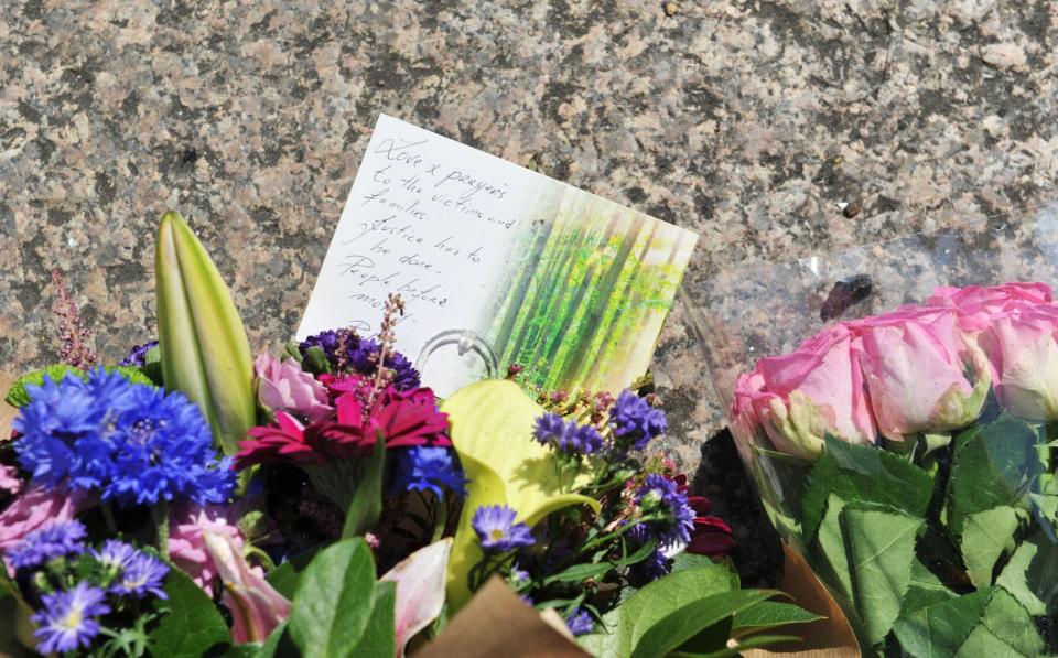 Tributes are left to the victims of the Grenfell Tower blaze (PA Images)