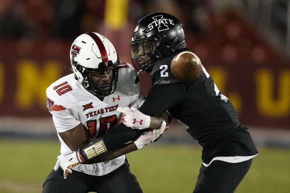 Iowa State defensive back T.J. Tampa (2) breaks up a pass intended for Texas Tech wide receiver Trey Cleveland (10) during the first half of an NCAA college football game, Saturday, Nov. 19, 2022, in Ames, Iowa. (AP Photo/Charlie Neibergall)