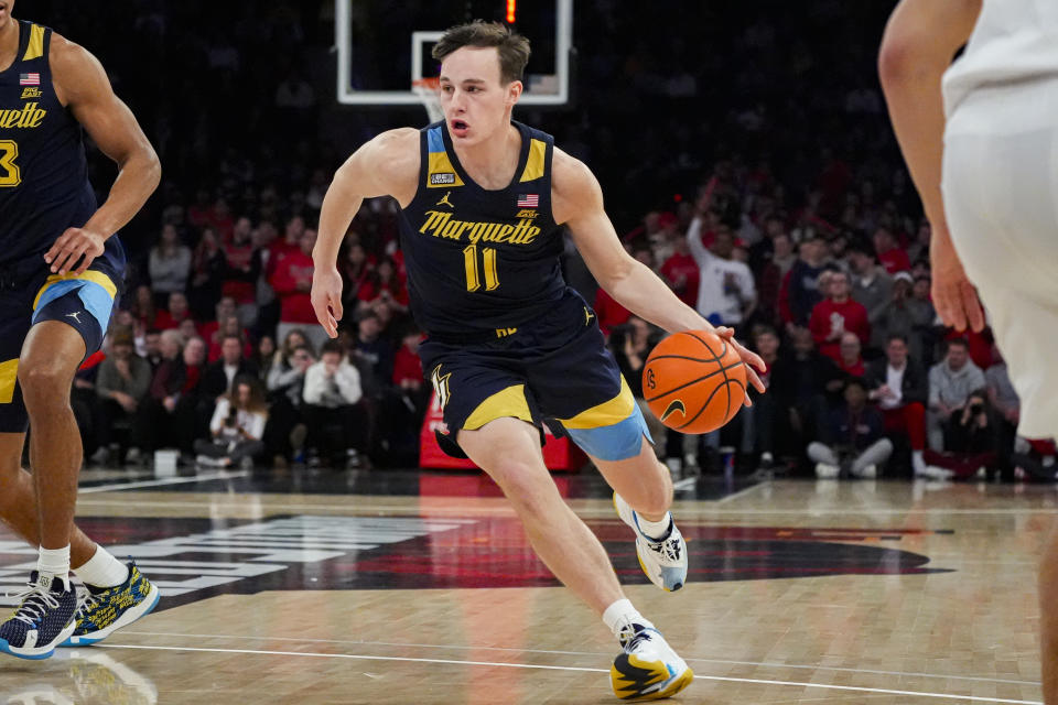 Marquette guard Tyler Kolek (11) drives to the basket during the first half of an NCAA college basketball game against St. John's in New York, Saturday, Jan. 20, 2024. (AP Photo/Peter K. Afriyie)