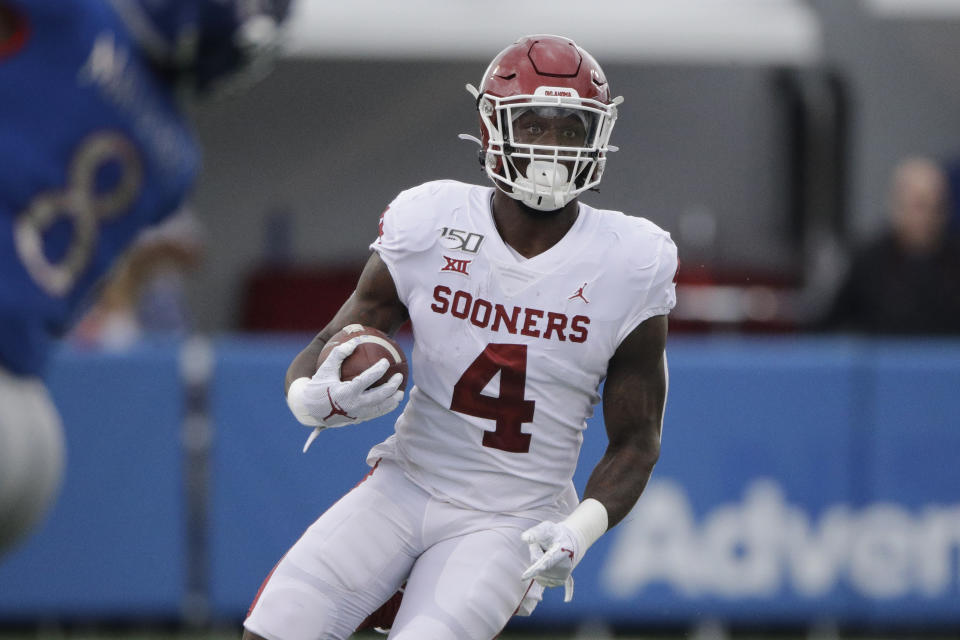 Oklahoma running back Trey Sermon runs during the first half of an NCAA college football game against Kansas Saturday, Oct. 5, 2019, in Lawrence, Kan. (AP Photo/Charlie Riedel)