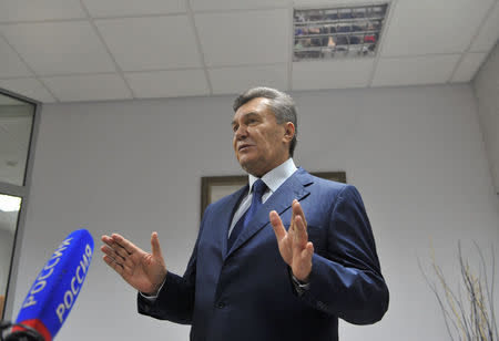 Ukraine's former President Viktor Yanukovich talks to the media after a video link with a Ukrainian court during the trial of former riot police force members, suspected of killing participants of the 2014 anti-government and pro-European Union mass protests, inside a building of a regional court in Rostov-on-Don, Russia, November 25, 2016. REUTERS/Stringer