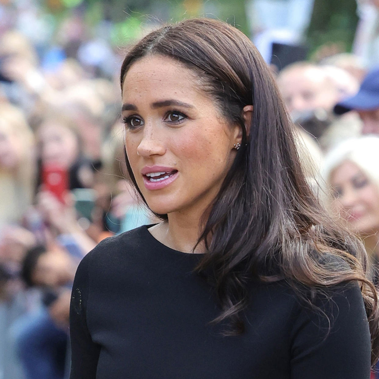 Meghan Markle looks at floral tributes Windsor Castle