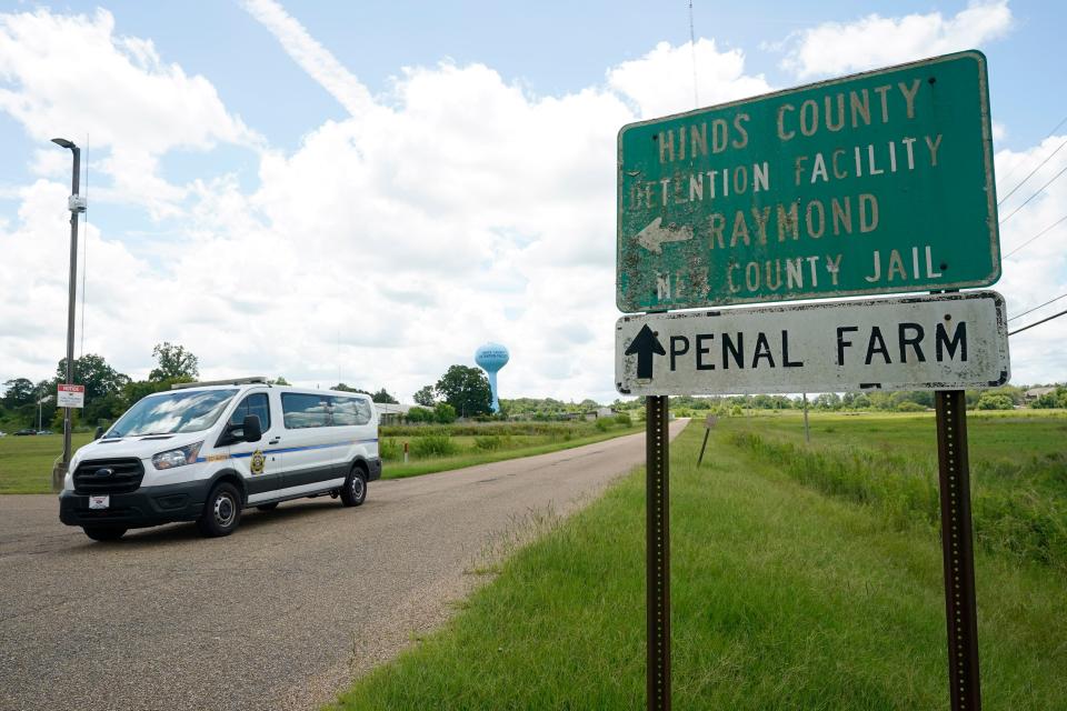 A Hinds County Sheriff's Department van passes the entrance to Hinds County Detention Facility, Aug. 1, 2022, in Raymond, Miss.