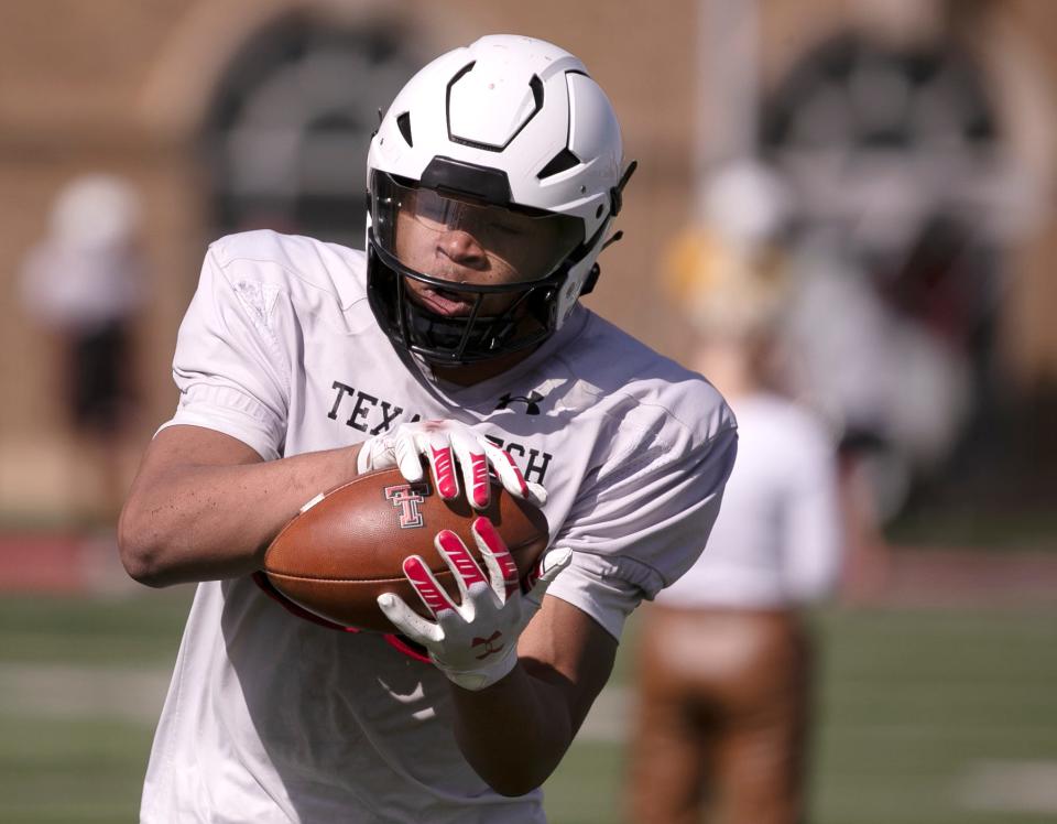 Texas Tech running back Anquan Willis tucks away a pass during spring football spring practice. Tech coach Joey McGuire compares Willis to former Baylor running back Abram Smith, who ran for a school-record 1,601 yards in 2021.