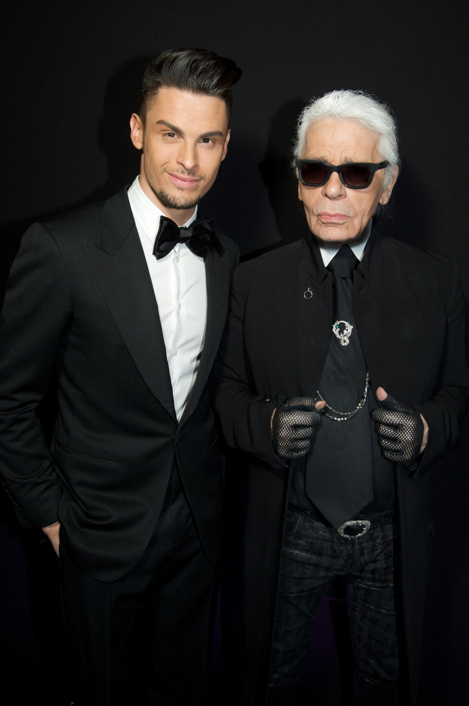 Karl Lagerfeld and Baptiste Giabiconi attend the Karl Lagerfeld New Perfume launch party at Palais Brongniart, in Paris. 