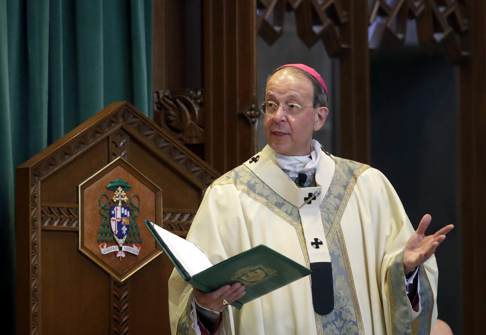 FILE - In this March 28, 2017, file photo, Baltimore Archbishop William Lori leads a funeral Mass in Baltimore. On Wednesday, June 5, 2019, Lori released a report on an investigation into former Roman Catholic Bishop Michael Bransfield, in West Virginia, that found a "consistent pattern" of sexual innuendo and suggestive comments and actions toward subordinates. (AP Photo/Patrick Semansky, File)