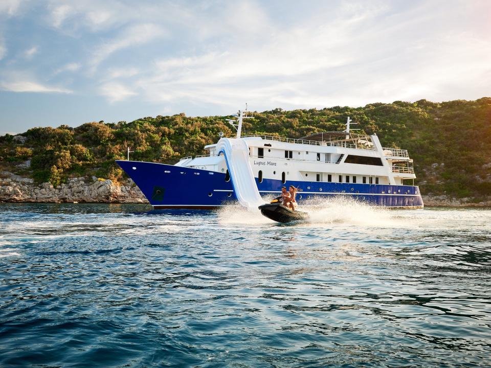 lupus mare superyacht with people traveling by