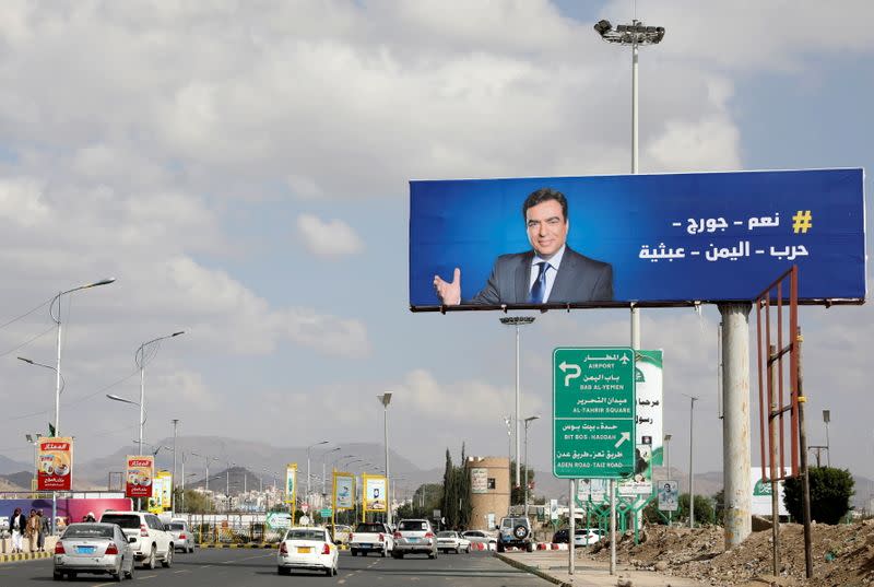 FILE PHOTO: Poster of Lebanese Information Minister George Kordahi is seen on billboard in Sanaa, Yemen