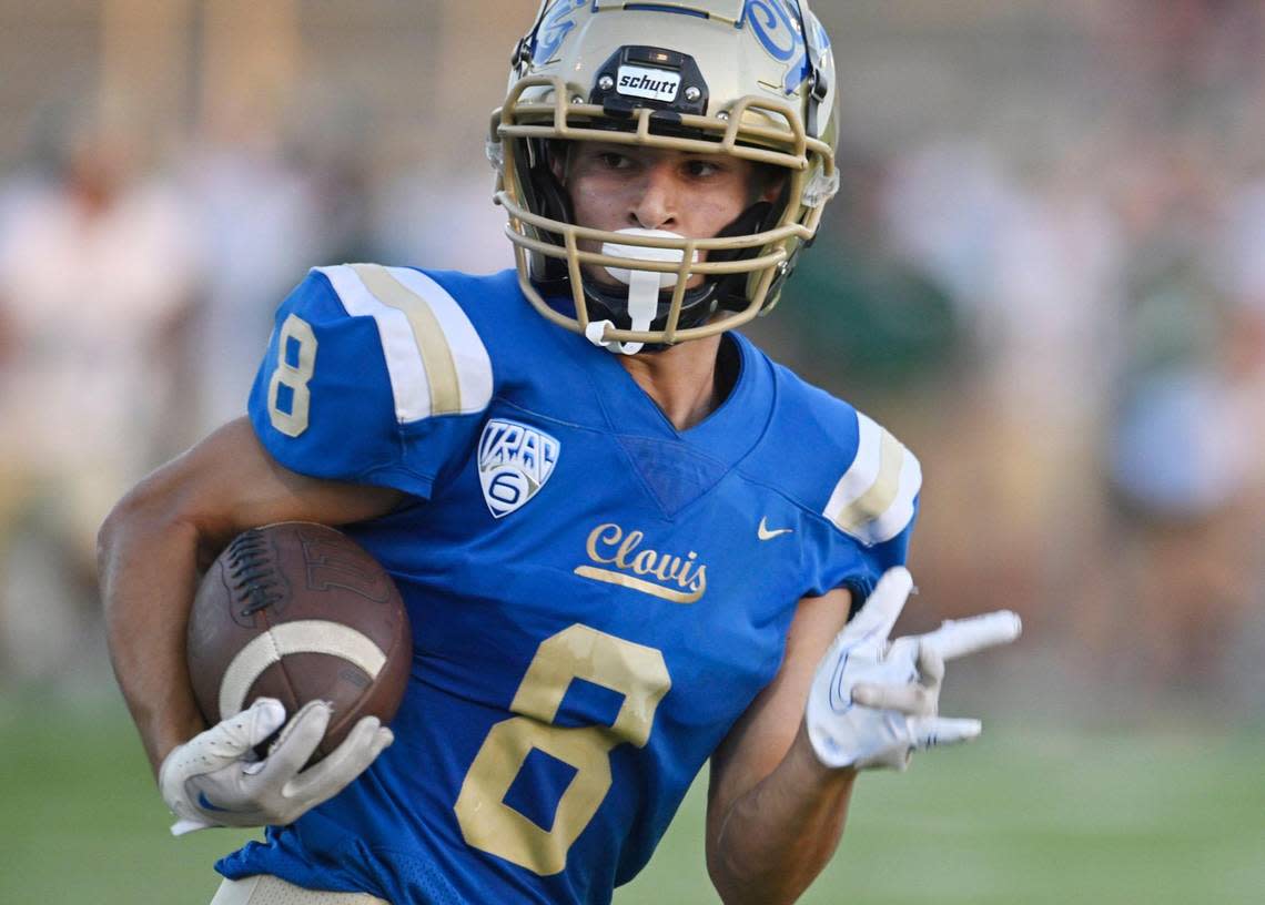 Clovis High’s Tyler Marquez runs the ball in for the second touchdown against Garces Thursday, Aug. 17, 2023 in Clovis. ERIC PAUL ZAMORA/ezamora@fresnobee.com