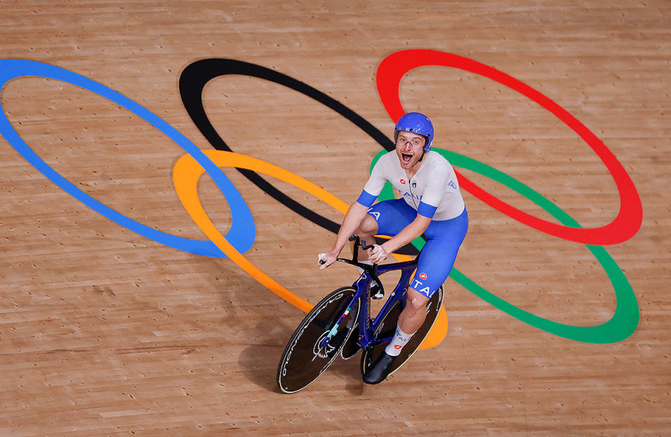 <p>Italy's Simone Consonni is in shock after winning gold and setting a new world record in the men's track cycling team pursuit finals at Izu Velodrome on August 4.</p>