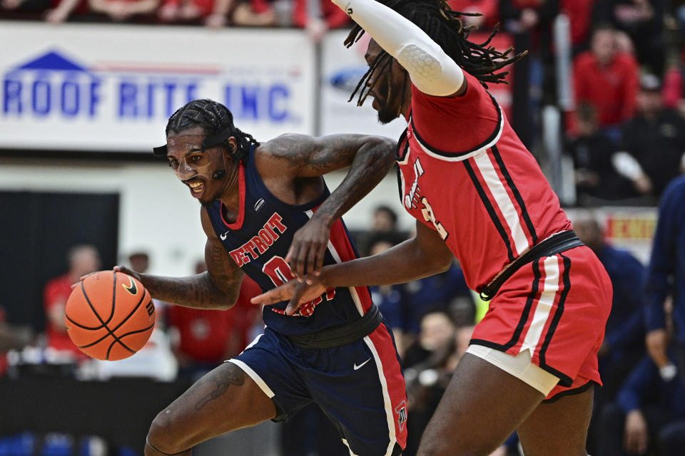 Detroit Mercy guard Antoine Davis (0) is pressured by Youngstown State guard Garrett Covington during the first half of an NCAA college basketball game in the quarterfinals of the Horizon League tournament, Thursday, March 2, 2023, in Youngstown, Ohio. (AP Photo/David Dermer)