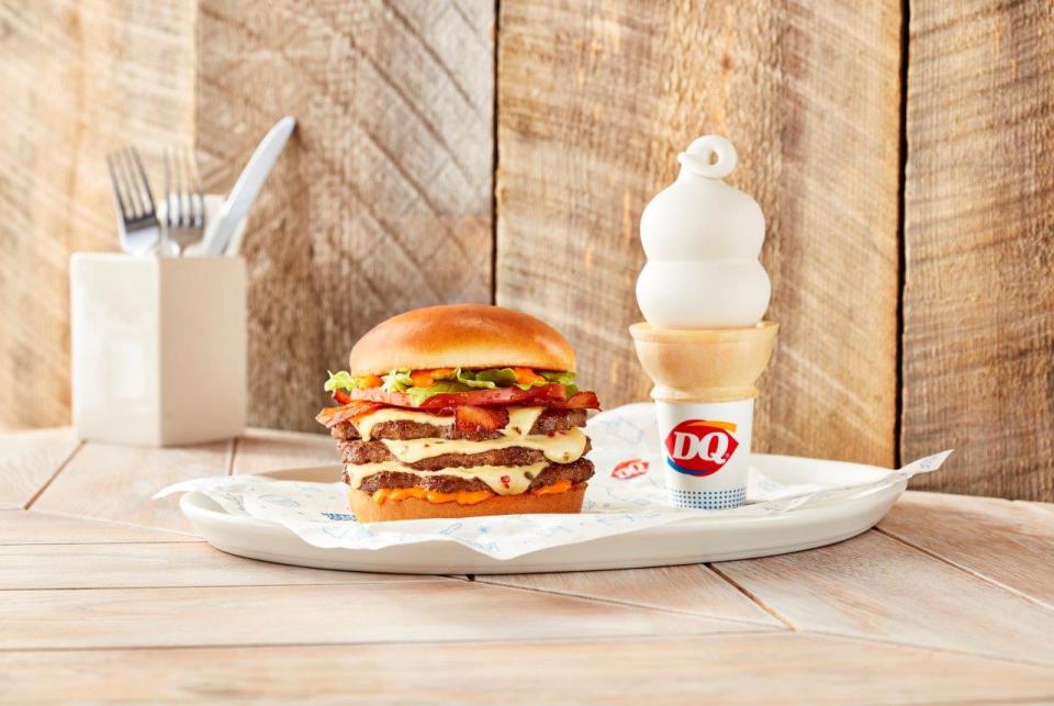Customers can celebrate National Cheeseburger Day on Sunday, Sept. 18, 2022, by using the DQ app and get $1 off any of the restaurant's five Signature Stackburgers, including the original cheeseburger and the FlameThrower (shown here) with fiery FlameThrower sauce, Pepper Jack cheese and jalapeño bacon..
