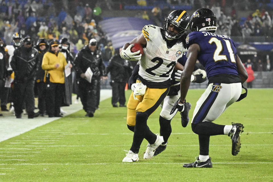 Jan 6, 2024; Baltimore, Maryland, USA; Pittsburgh Steelers running back Najee Harris (22) rushes as Baltimore Ravens cornerback Brandon Stephens (21) defends during the second half at M&T Bank Stadium. Mandatory Credit: Tommy Gilligan-USA TODAY Sports