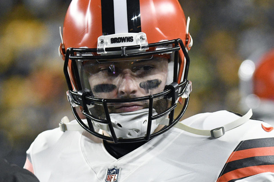 FILE Cleveland Browns quarterback Baker Mayfield plays in an NFL football game against the Pittsburgh Steelers, Monday, Jan. 3, 2022, in Pittsburgh. No longer part of Cleveland's future, Mayfield is not participating in the team's voluntary offseason program as the team tries to work out a trade. On Tuesday, coach Kevin Stefanski was reluctant to address the polarizing QB at all. (AP Photo/Don Wright, File)