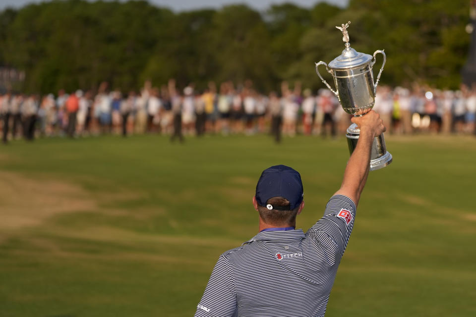 Bryson DeChambeau holds the trophy after winning the U.S. Open golf tournament Sunday, June 16, 2024, in Pinehurst, N.C. (AP Photo/George Walker IV)