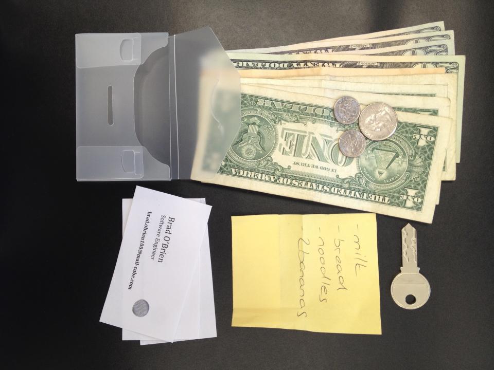 This undated photo provided by researchers in June 2019 shows an example of the contents of a transparent wallet used in an experiment to test how likely people are to return a lost wallet. "The evidence suggests that people tend to care about the welfare of others, and they have an aversion to seeing themselves as a thief," said Alain Cohn of the University of Michigan, one author who reported the results Thursday, June 20, 2019 in the journal Science. (Christian Zuend via AP)