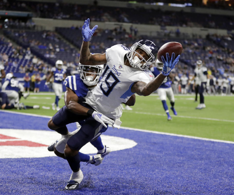 <p>Tennessee Titans’ Tajae Sharpe (19) makes a touchdown catch against Indianapolis Colts’ Kenny Moore during the second half of an NFL football game Sunday, Nov. 18, 2018, in Indianapolis. (AP Photo/Michael Conroy) </p>