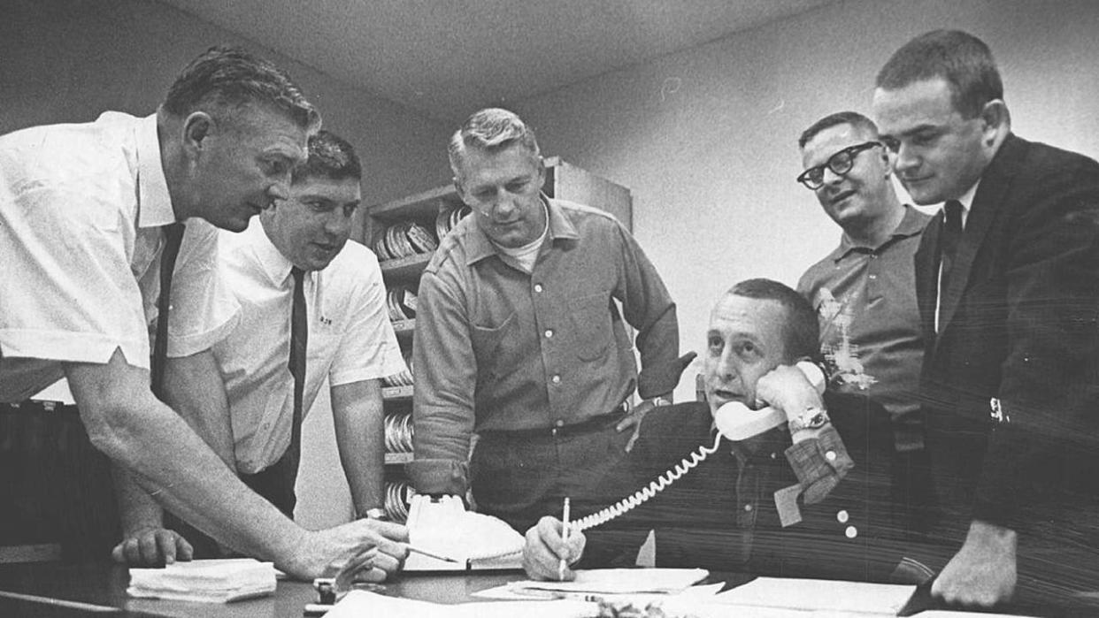 <div>NOV 29 1964, NOV 30 1964; Broncos GM Operates From "Hot Line Central"; Denver Broncos General Manager Cal Kunz (seated) calls in a draft pick to American Football League headquarters in New York during Saturday's draft session at the Bronco office. Watching are Coach Mac Speedie (left), defensive line coach Ray Malavasi, personnel director Bill Meek and Paul Manasseh, Don Smith of front office staff.; (Photo By Ed Maker/The Denver Post via Getty Images)</div>