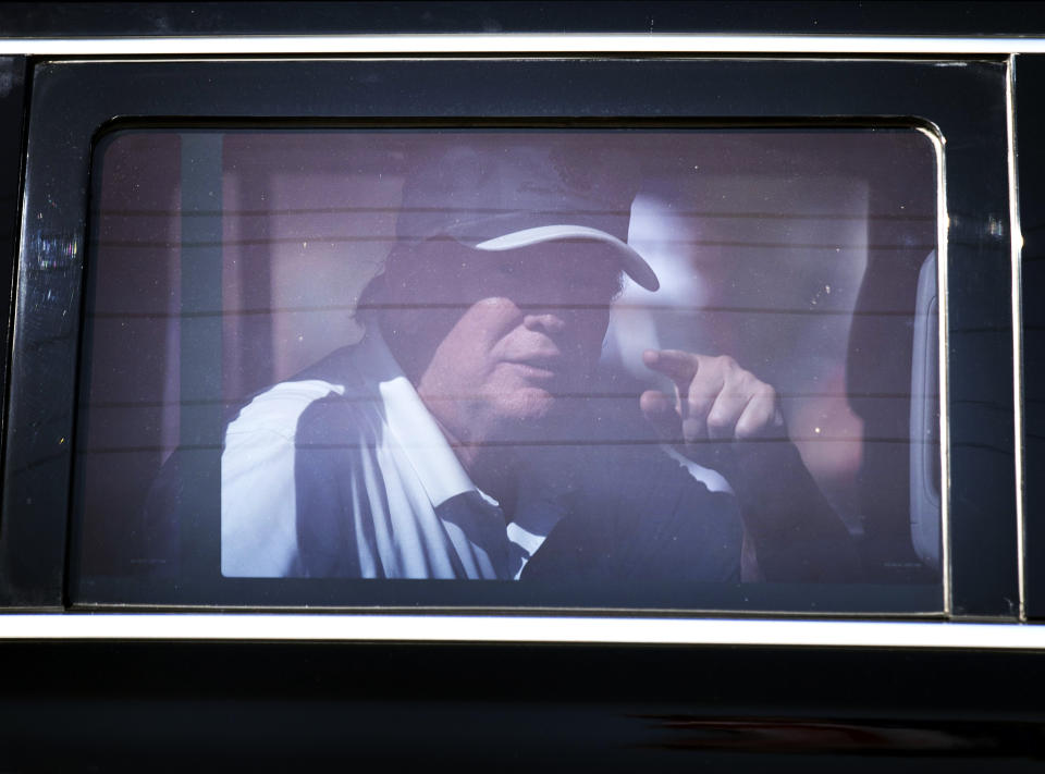 Former President Donald Trump reacts as he is driven past supporters on Presidents Day in West Palm Beach, Florida. (Photo: Joe Raedle/Getty Images)