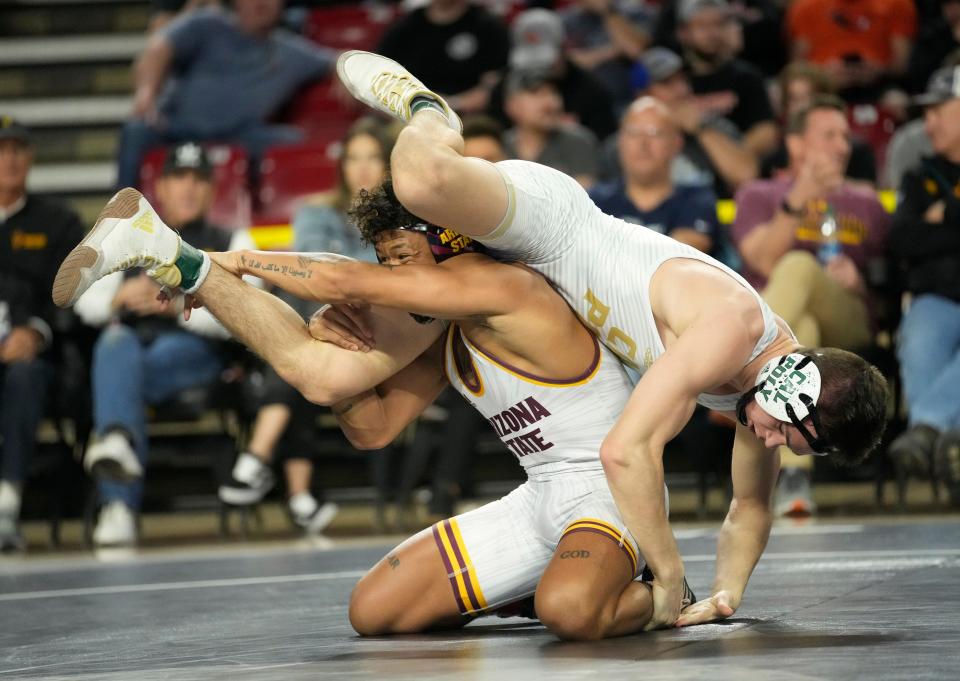 Mar 6, 2022; Tempe, Arizona, U.S.;  Arizona State's Kyle Parco wrestles Cal Poly's Legend Lamer in the 149 pound weight class during the finals of the Pac-12 wresting championships at Desert Financial Arena. Mandatory Credit: Michael Chow-Arizona Republic