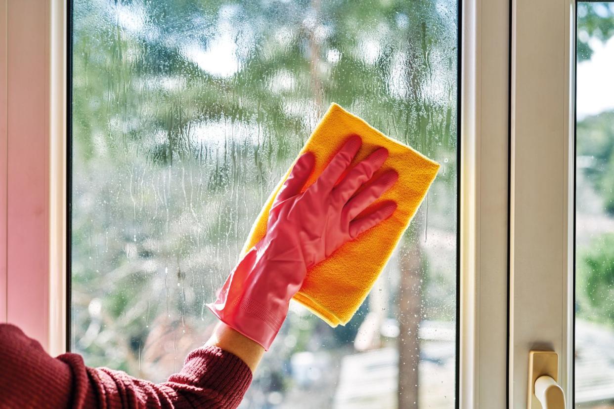 person cleaning windows