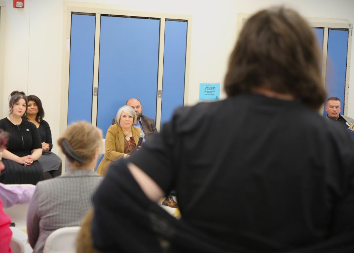 Gov. Michelle Lujan Grisham, center, listens with members of her Cabinet as Animas Elementary School art teacher Nicole Wayne speaks during a town hall meeting at the school on Thursday, April 11.