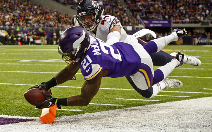 Jan 1, 2017; Minneapolis, MN, USA; Minnesota Vikings running back Jerick McKinnon (21) reaches for the pylon to score a touchdown ahead of the defense of Chicago Bears linebacker Nick Kwiatkoski (44) in the first quarter at U.S. Bank Stadium. Mandatory Credit: Bruce Kluckhohn-USA TODAY Sports