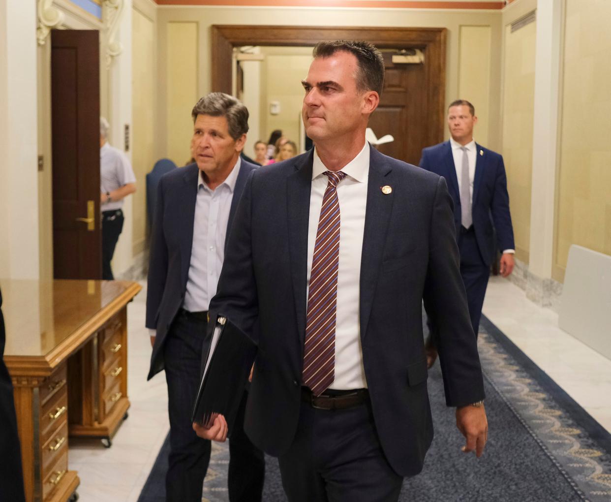 Gov. Kevin Stitt walks into a news conference about SCOTUS ruling to overturn Roe v. Wade in the Blue Room at the Capitol on June 24, 2022.