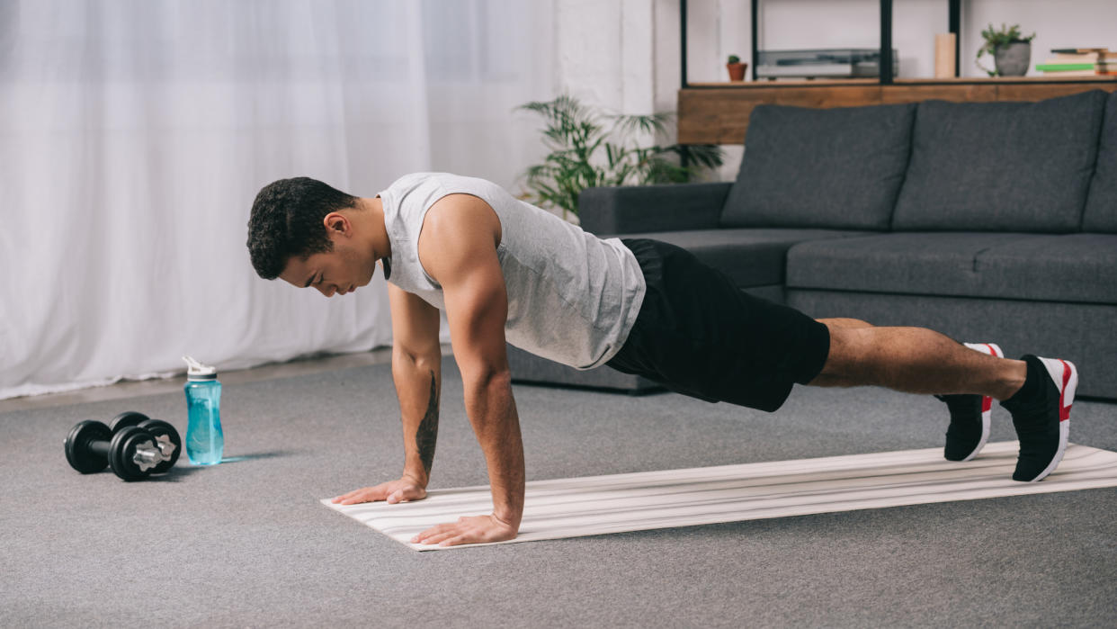  A man performing a push-up. 