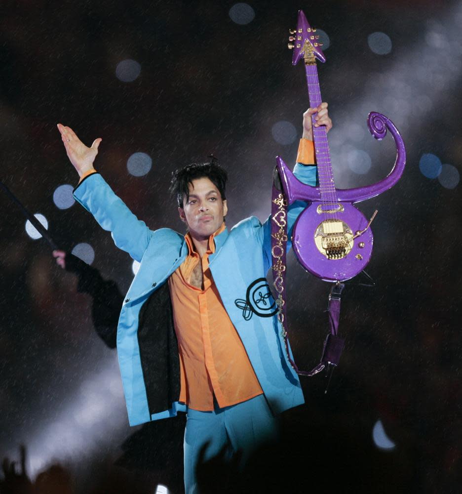 Prince performing during half-time at Super Bowl. The guitar he used during the show will also make an appearance at the O2 exhibition.