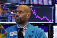 Specialist Meric Greenbaum works at his post on the floor of the New York Stock Exchange, Tuesday, Oct. 8, 2019. Stocks are opening lower on Wall Street as tensions rose between Washington and Beijing just ahead of the latest round of trade talks. (AP Photo/Richard Drew)