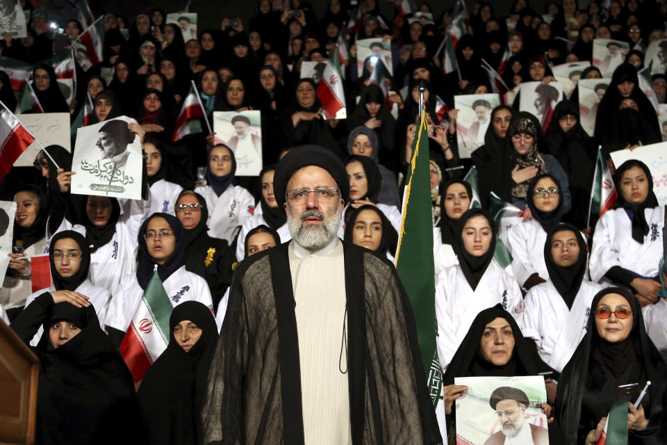 FILE -- In this April 29, 2017 file photo, hard-line cleric Ebrahim Raisi attends a 2017 presidential election rally in Tehran, Iran. On Thursday March 7, 2019, Iran's Supreme Leader Ayatollah Ali Khamenei named Raisi as the country's new judiciary chief. That’s sparked concern from rights activists over his involvement in the execution of thousands in the 1980s. Raisi’s selection comes after he was trounced by incumbent Hassan Rouhani in the country’s 2017 presidential election. (AP Photo/Ebrahim Noroozi, File)