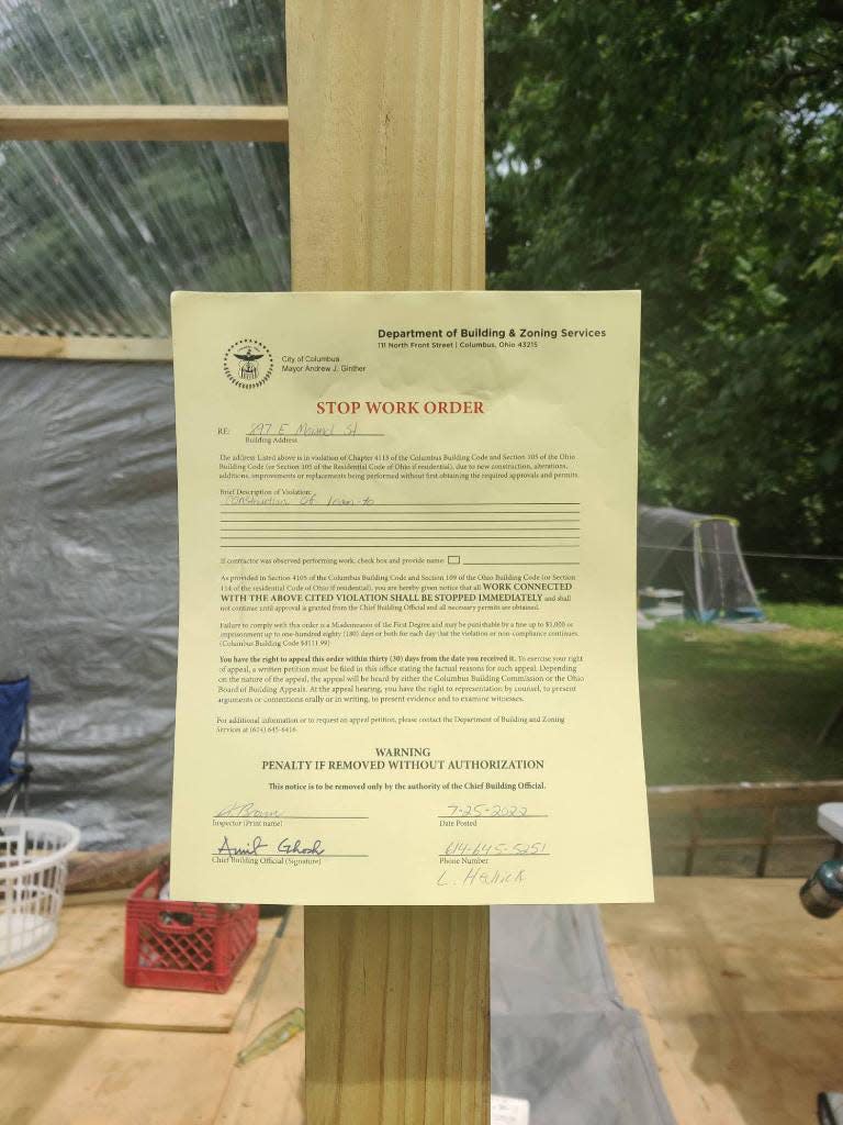 The stop work order posted for a plywood structure at the homeless camp at 935 E. Mound St.