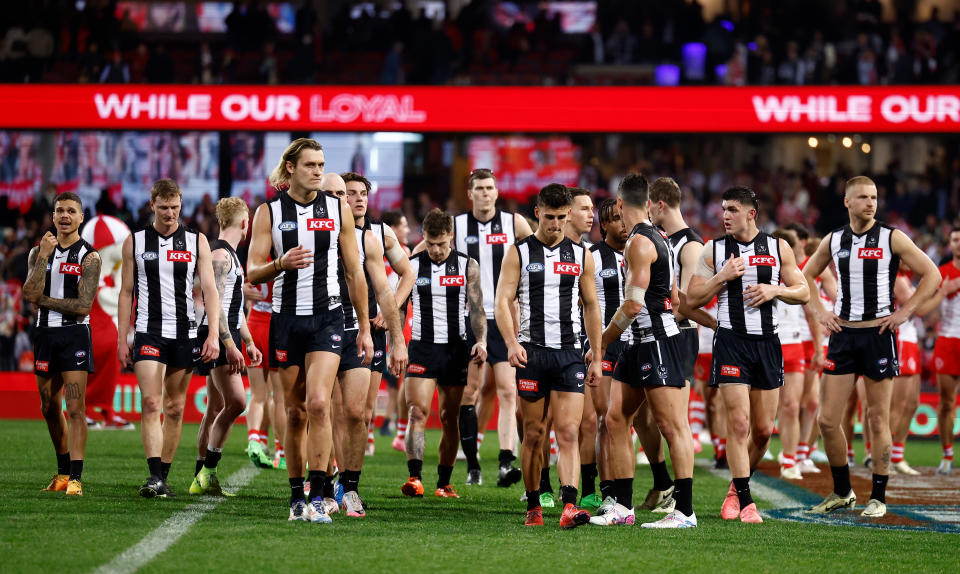 SYDNEY, AUSTRALIA - AUGUST 09: The Magpies look dejected after a loss during the 2024 AFL Round 22 match between the Sydney Swans and the Collingwood Magpies at The Sydney Cricket Ground on August 09, 2024 in Sydney, Australia. (Photo by Michael Willson/AFL Photos via Getty Images)