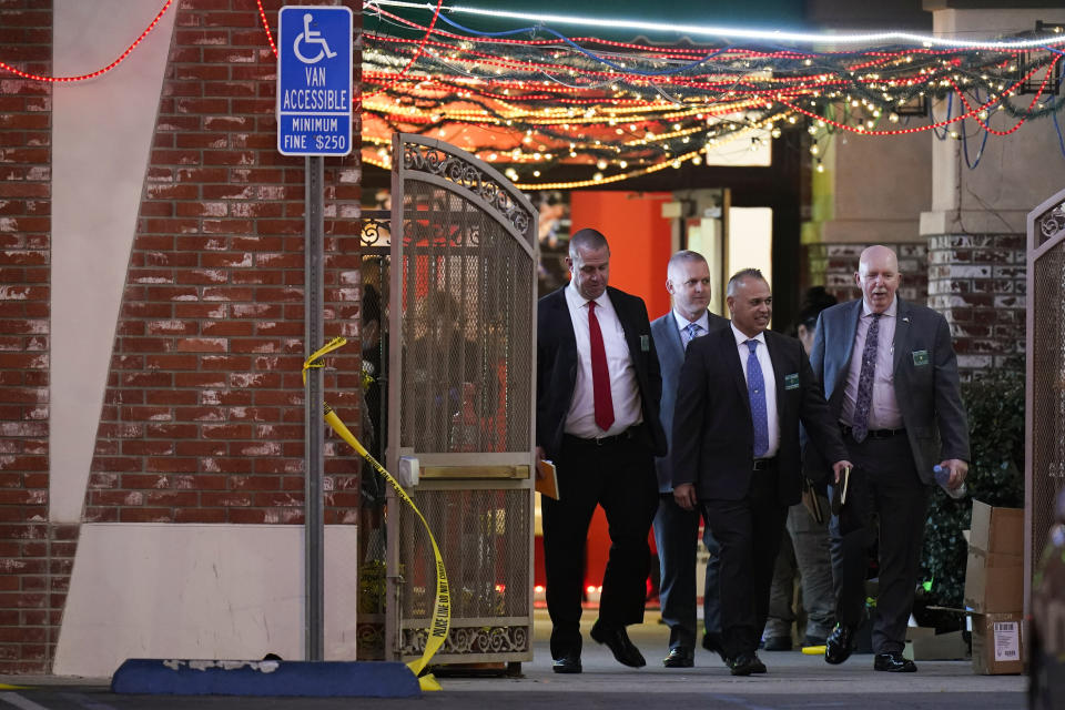 Investigators leave the Star Ballroom Dance Studio following Saturday's fatal mass shooting in Monterey Park, Calif., Sunday, Jan. 22, 2023. (AP Photo/Jae C. Hong)